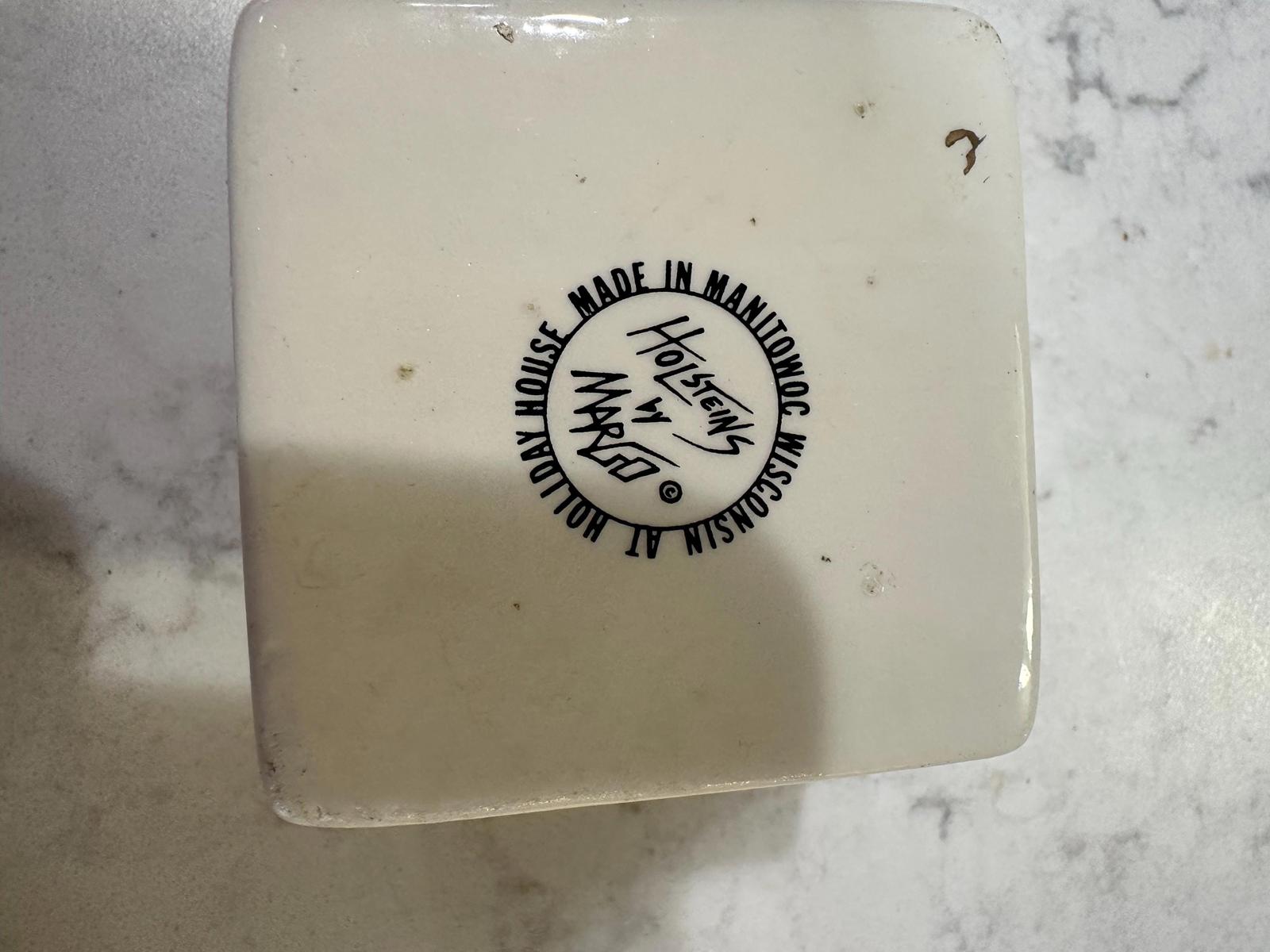 Ceramic milk carton with Holstein cow design